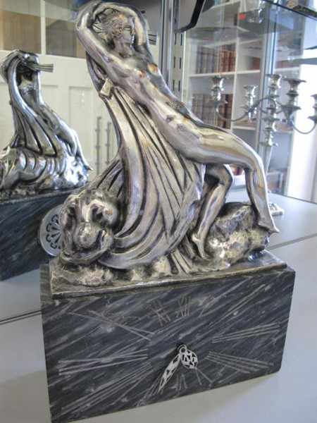 Appraisal: FRENCH ART DECO STYLE SILVERED FIGURAL MANTEL CLOCK ON MARBLE