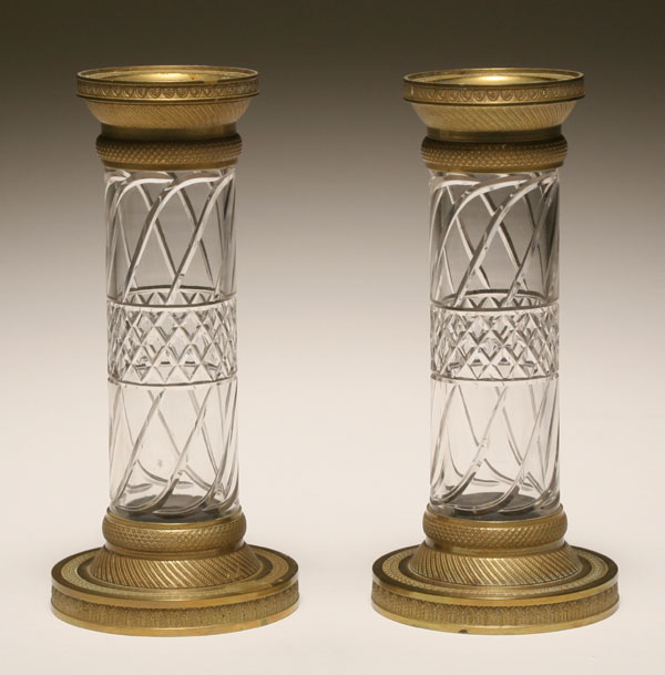 Appraisal: Pair Continental brass candlesticks with glass stems geometric design to