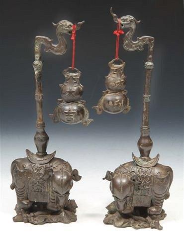 Appraisal: A PAIR OF CHINESE BRONZE ELEPHANT STANDS with auspicious double