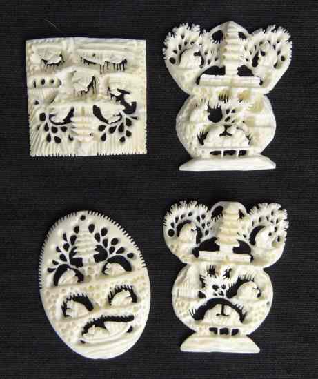 Appraisal: Lot Asian ivory pierced village scene pendents