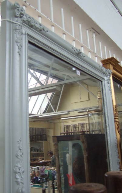 Appraisal: A th century grey painted overmantel mirror the frame relief