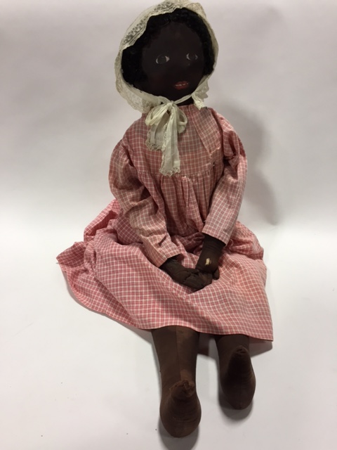 Appraisal: VERY LARGE BLACK DOLL WITH PAINTED FACE Nineteenth century Wool