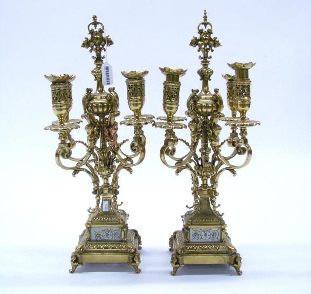 Appraisal: Pair of Brass Four Branch Candelabra '' high with figural