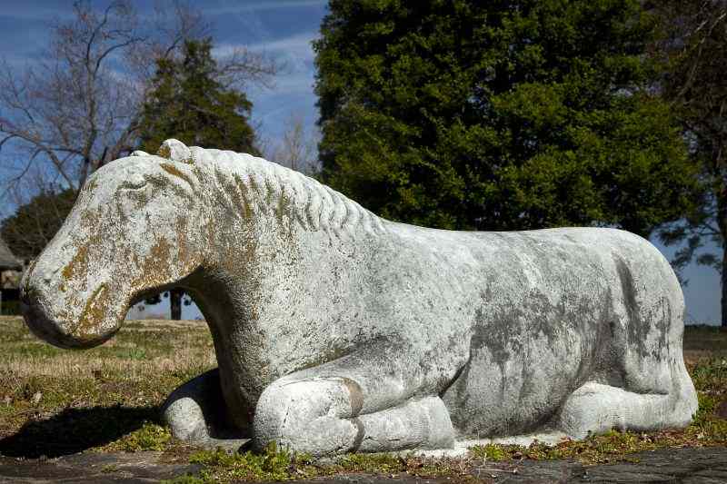 Appraisal: Chinese Carved Stone Spirit Road Reclining HorseMing Dynasty style sculpted