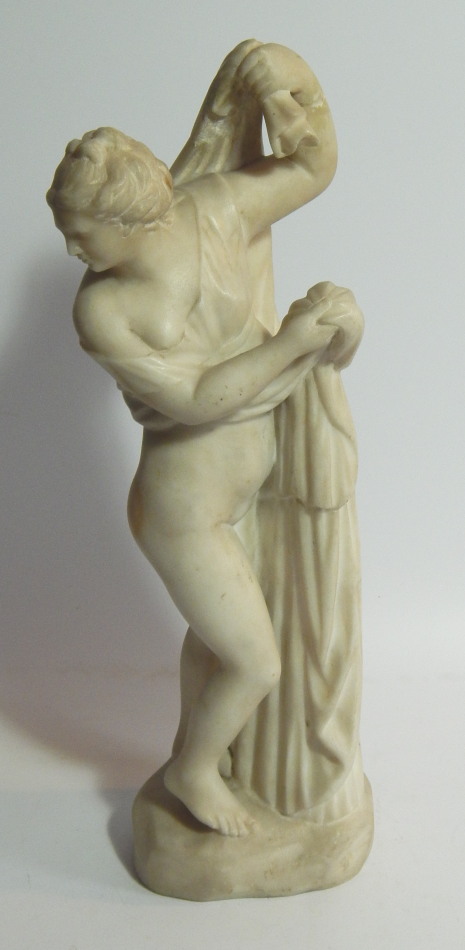 Appraisal: A white marble figure of a classical semi-nude woman in