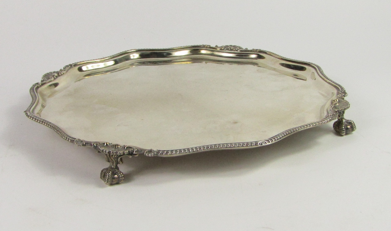 Appraisal: A silver piecrust salver with a gadrooned and shell cast