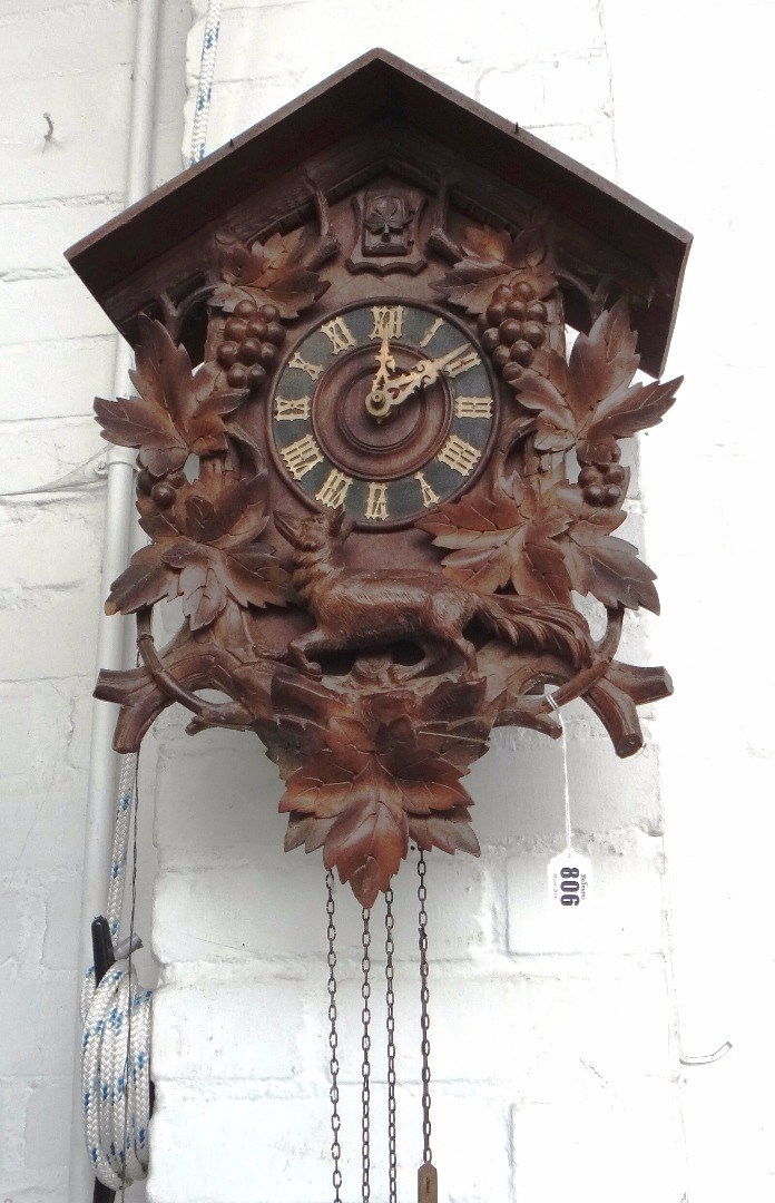 Appraisal: A Black Forest carved wooden cuckoo clock early th century