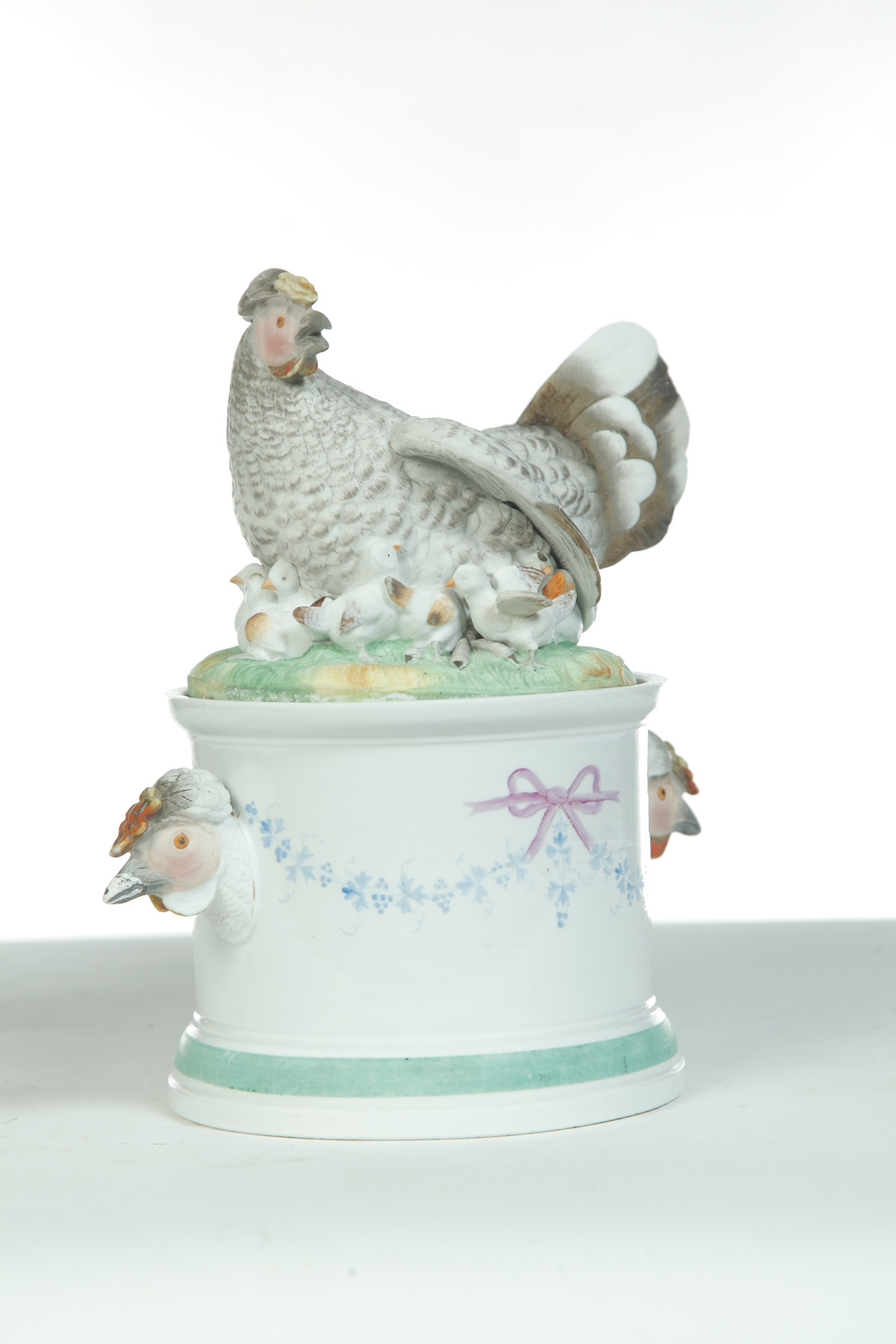 Appraisal: UNUSUAL PORCELAIN HEN ON CYLINDRICAL BASE Germany th quarter- th