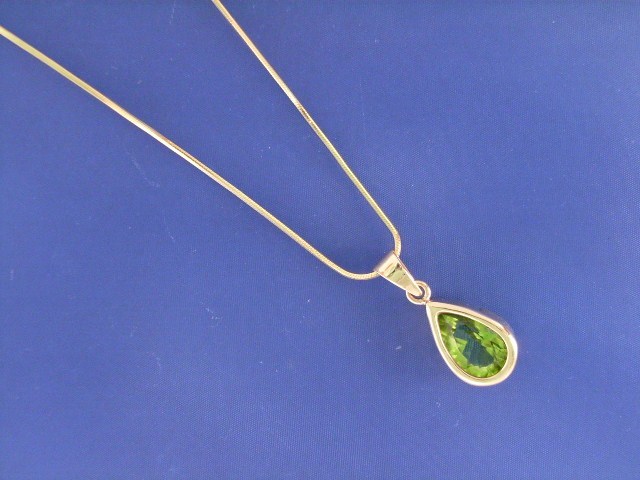 Appraisal: A ct gold peridot pendant on a ct gold chain