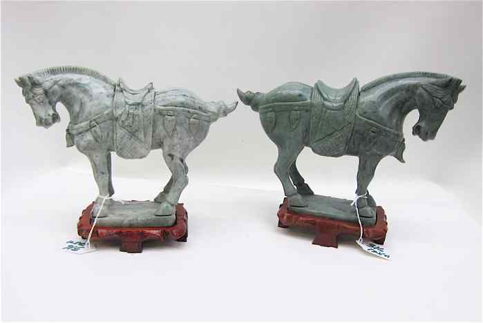 Appraisal: PAIR HAND SCULPTED HARDSTONE TANG STYLE HORSES standing with classic