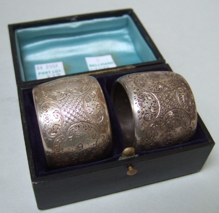 Appraisal: A pair of Victorian silver napkin rings each with floral