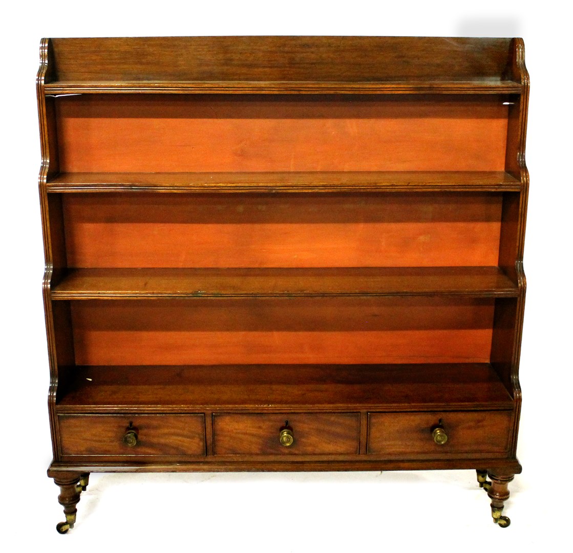 Appraisal: A George III mahogany four tier waterfall bookcase with three