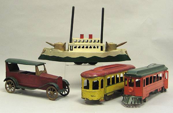 Appraisal: Flywheel metal toy transportation vehicles Lot features pressed steel toys