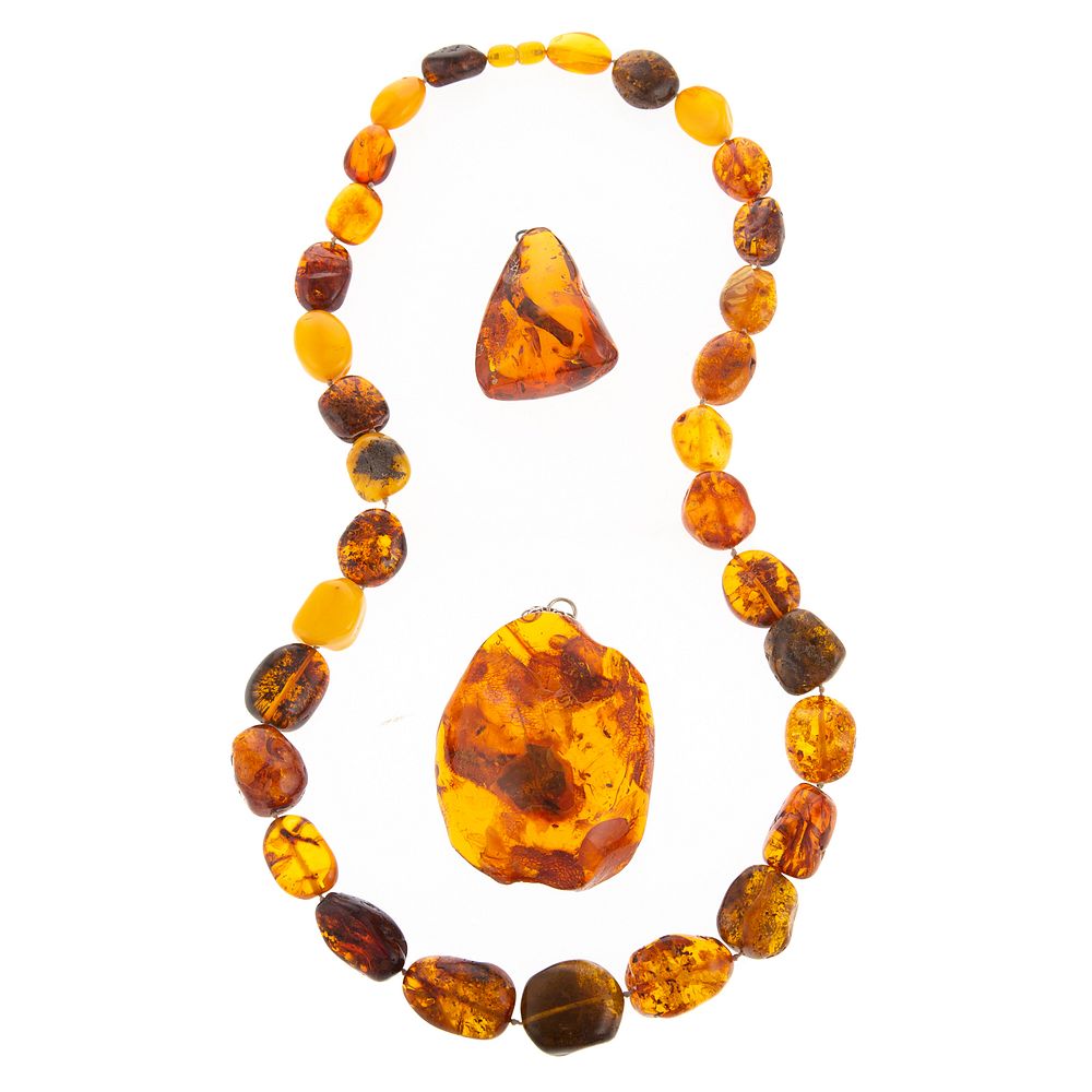 Appraisal: A Graduated Amber Necklace Two Amber Pendants Amber necklace featuring