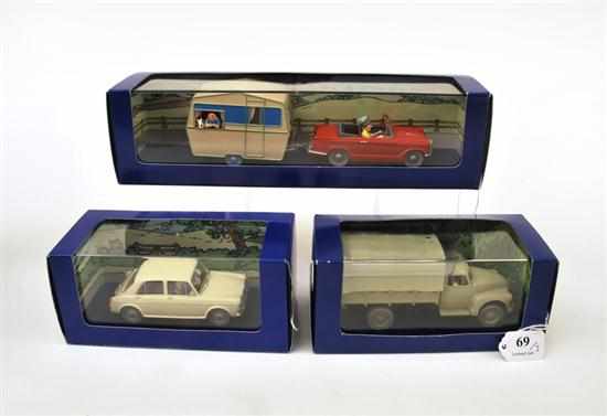 Appraisal: THREE EN VOITURE TINTIN FIGURES FROM TINTIN COMICS INCLUDING X