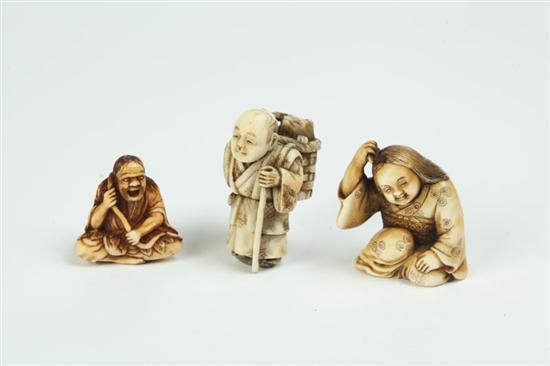 Appraisal: THREE IVORY NETSUKES Japan st half- th century Seated man