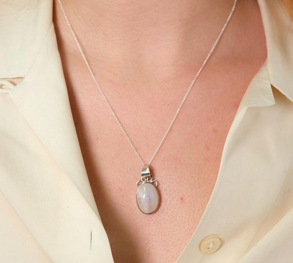 Appraisal: Sterling silver necklace hung with a oval Moonstone cabochon pendant