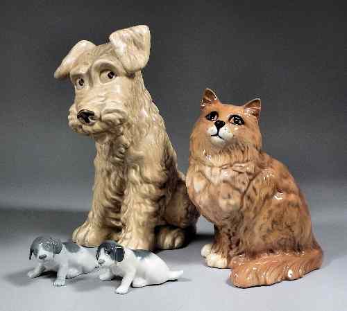 Appraisal: A Sylvac fawn glazed pottery figure of a sitting terrier