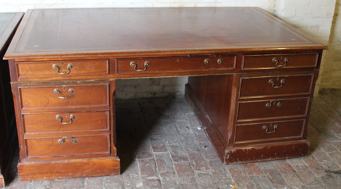 Appraisal: A thC mahogany partner's desk the upper section with a