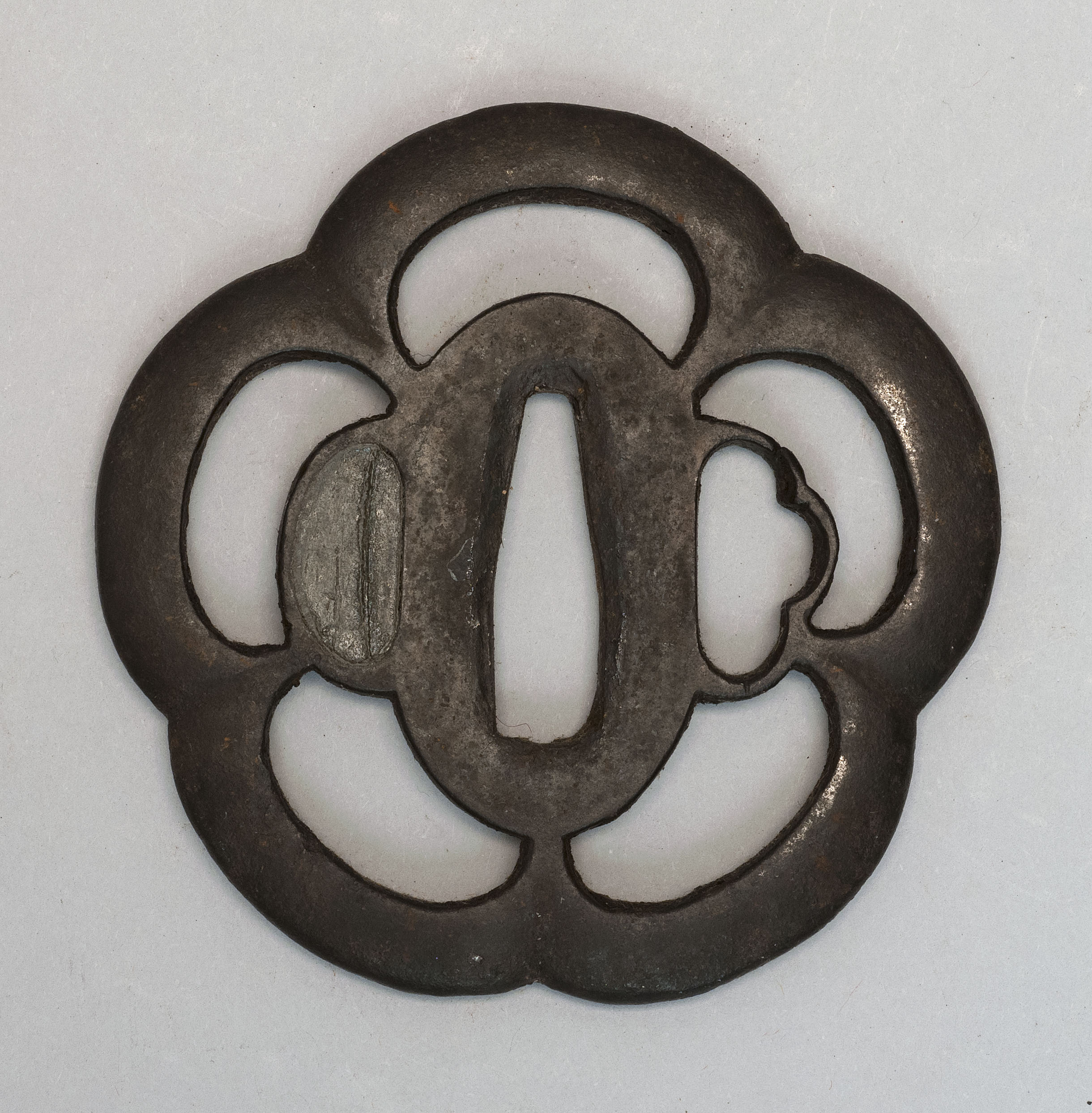 Appraisal: IRON FIVE-LOBED TSUBA th CenturyWith openwork design Length cm ConditionSome