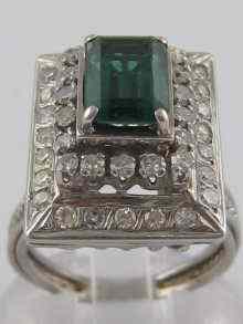 Appraisal: A white metal tests carat gold diamond and green tourmaline