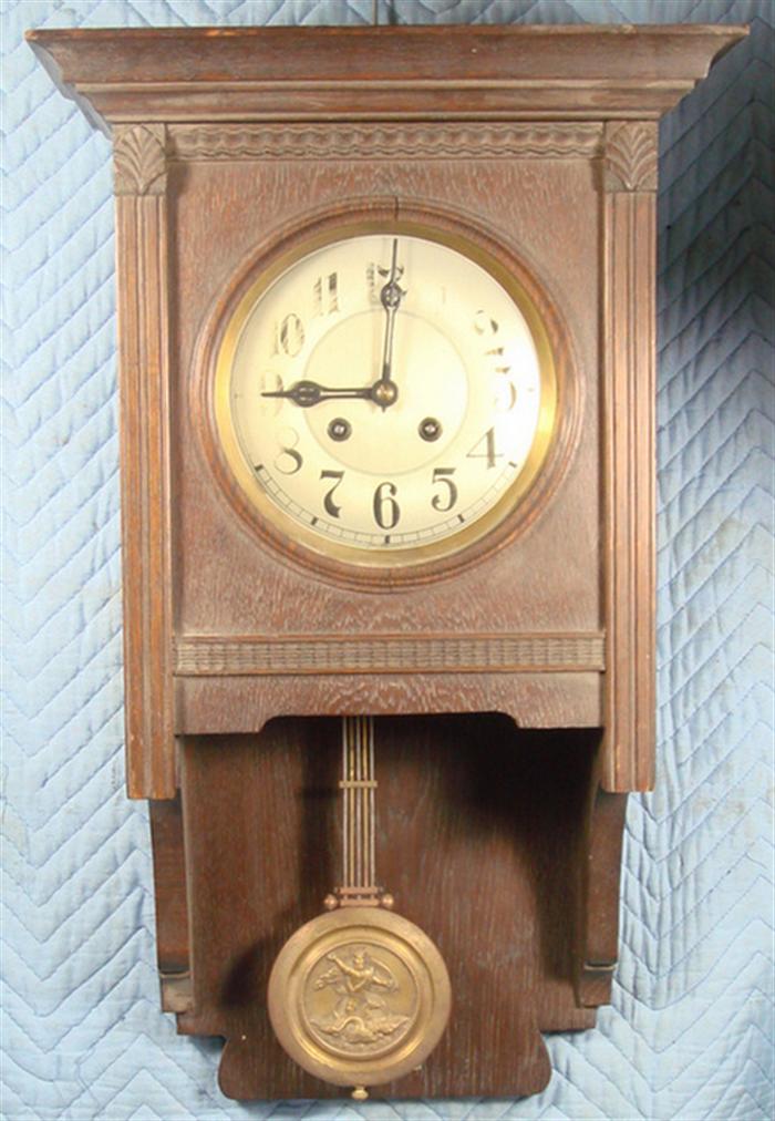 Appraisal: German oak wall clock open brass pendulum embossed with Neptune