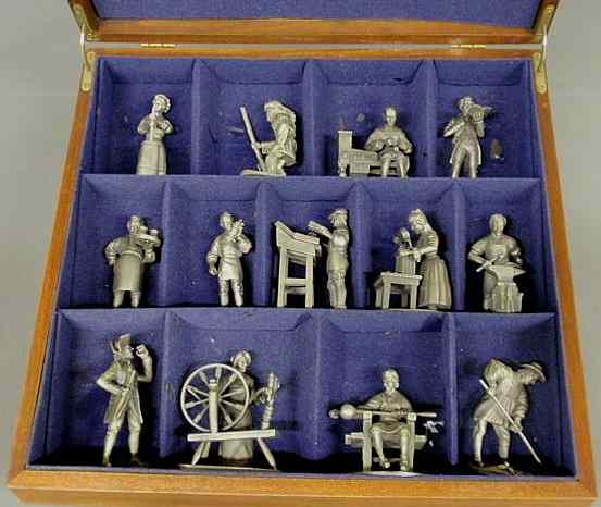 Appraisal: Mahogany cased set of thirteen pewter th c tradesman woman