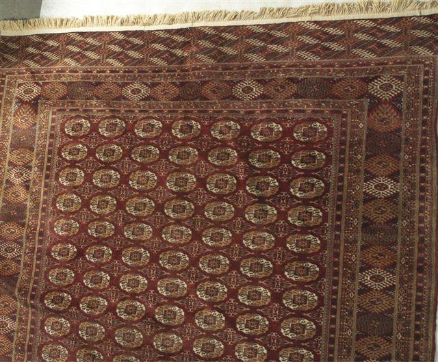 Appraisal: MORI BOKHARA RUG with a red ground m by m