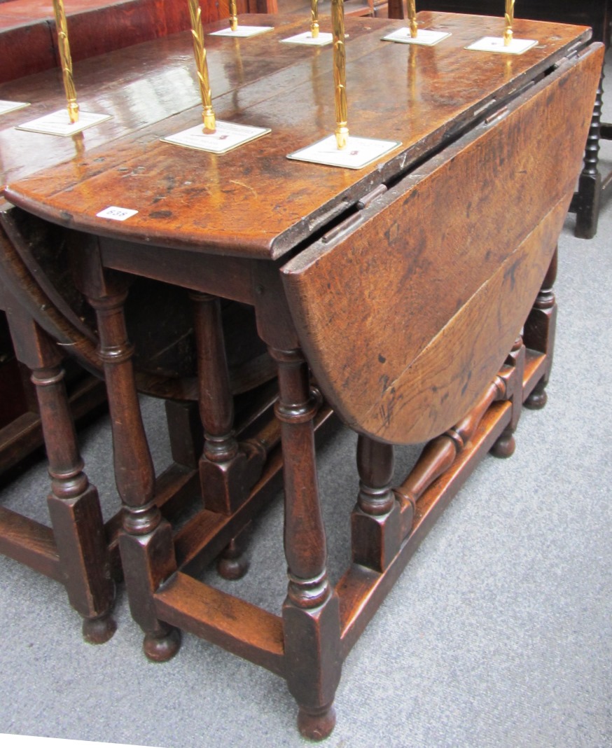 Appraisal: A th century oak drop flap table on baluster supports