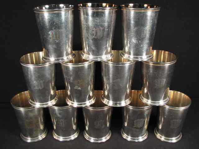 Appraisal: A set of twelve silver plated Julep cups Each measuring