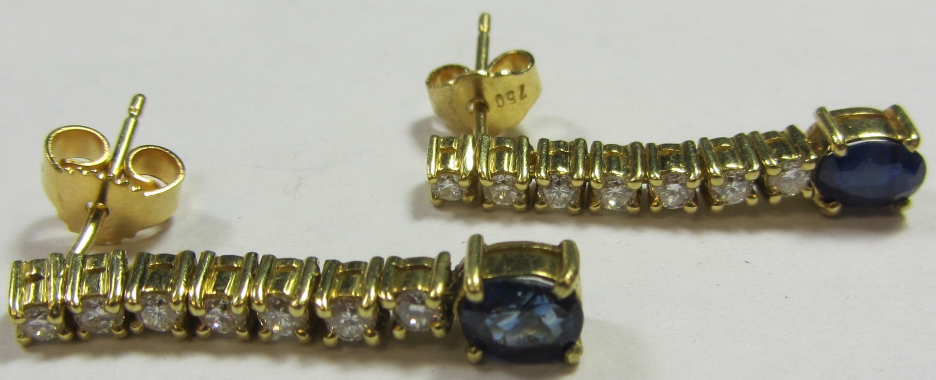 Appraisal: A pair of sapphire and diamond pendant earrings each in