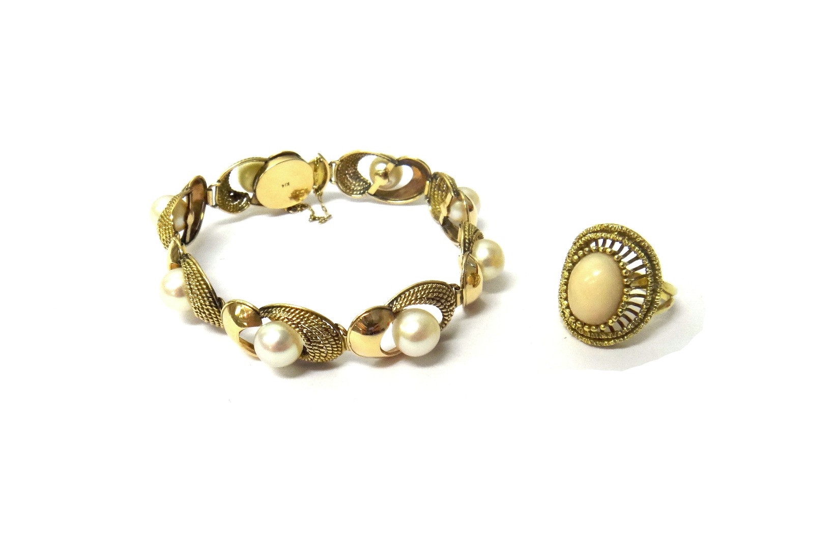 Appraisal: A gold and cultured pearl bracelet the shaped oval twin