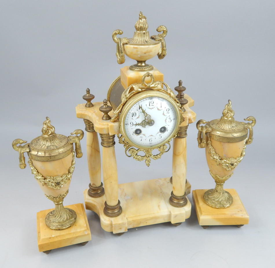 Appraisal: A thC French clock garniture the central clock with a