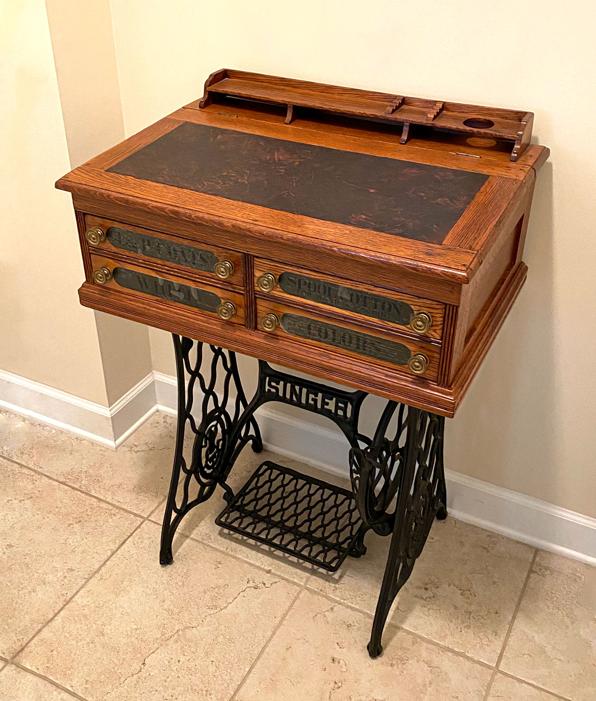 Appraisal: DRAWER SPOOL CABINET ON SINGER STAND J P Coats oak