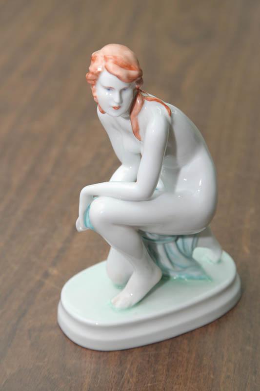 Appraisal: ZSOLNAY FIGURINE Nude woman crouching on an oval base h