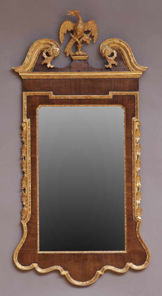 Appraisal: GEORGE II STYLE WALNUT AND PARCEL-GILT MIRROR The upright plate