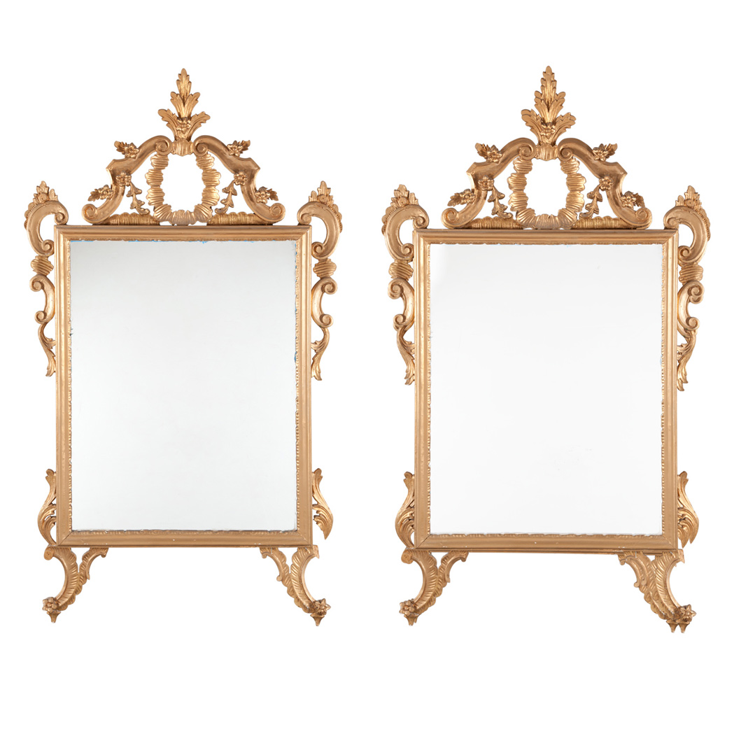 Appraisal: Pair of Rococo Style Giltwood Mirrors Each with an open