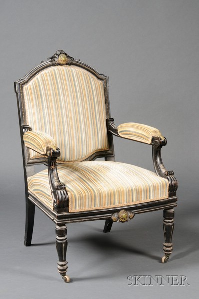 Appraisal: Napoleon III Ebonized and Gilt-bronze Mounted Armchair c shaped backrest