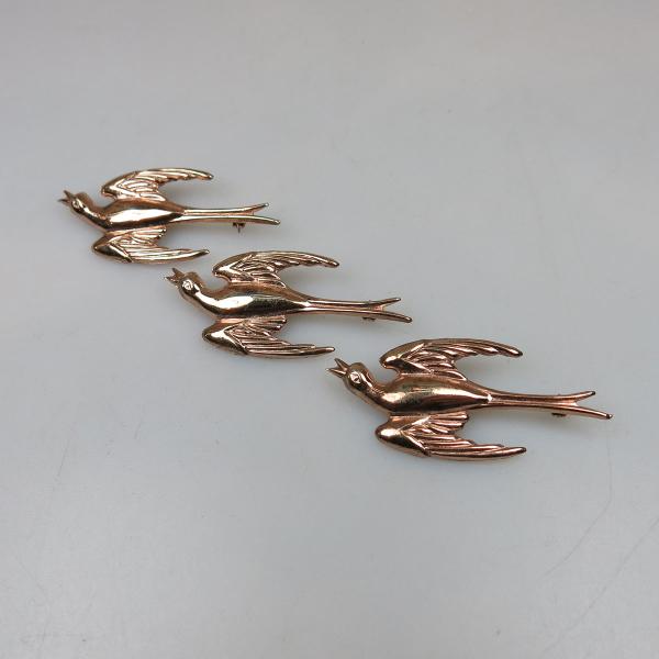 Appraisal: Set Of Three Coro Sterling Silver Gilt Pins formed as