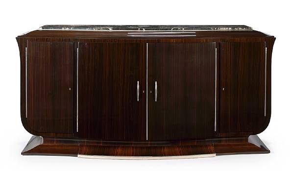 Appraisal: A French Art Deco ebony macassar and marble sideboard by