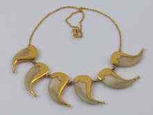 Appraisal: A tiger's claw necklace set in yellow metal tests high