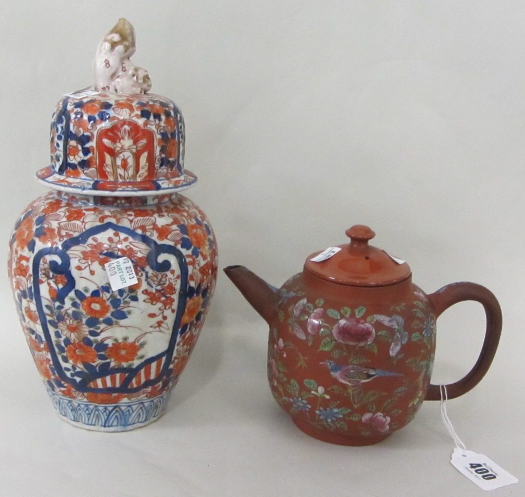 Appraisal: A Chinese Yixing ware teapot and a matched cover late