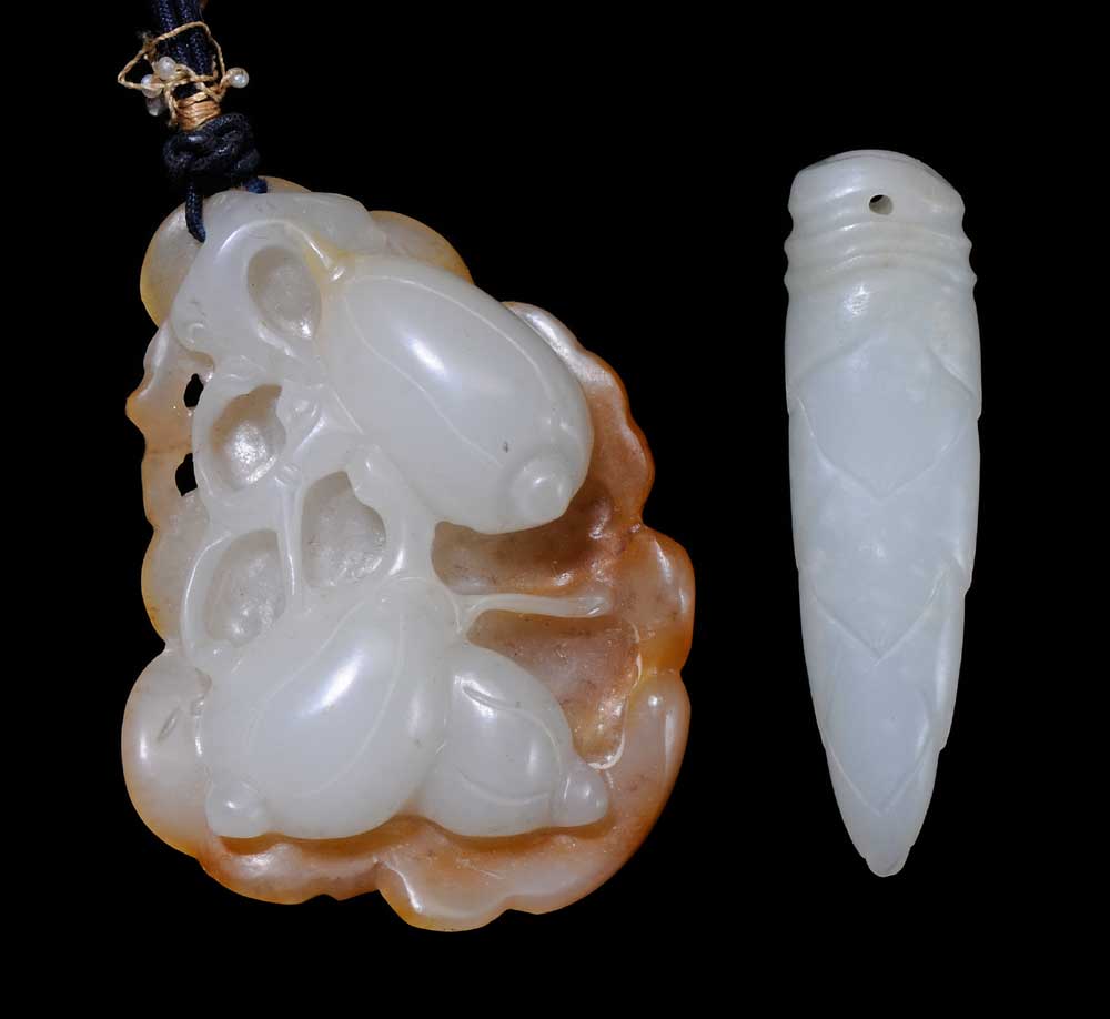 Appraisal: Two Jade Toggles Chinese white jade bamboo shoot drilled hole