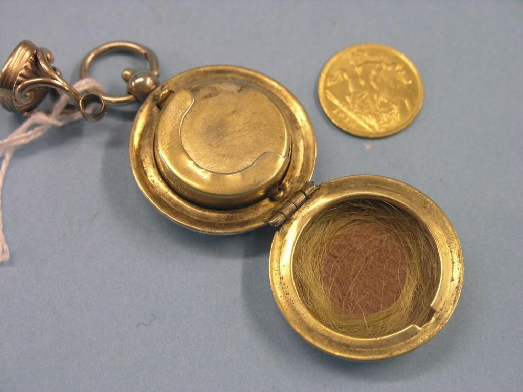 Appraisal: A gold half-sovereign contained within silver plated sovereign case also