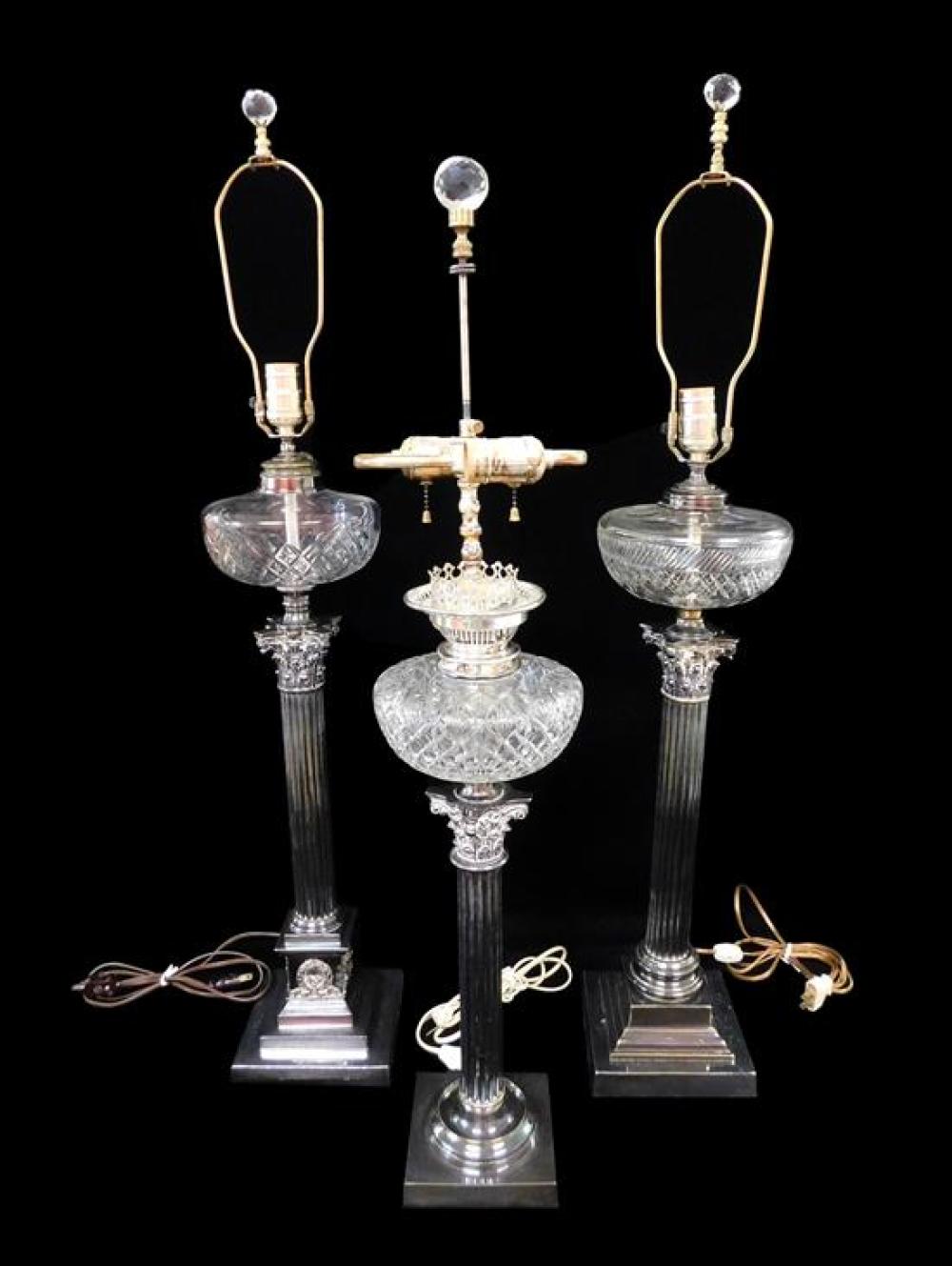 Appraisal: Three silver-plate column lamps with cut glass fonts all slightly