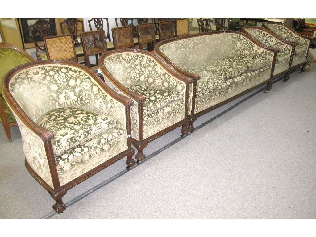 Appraisal: Carved walnut framed settee with four matching tub chairs all