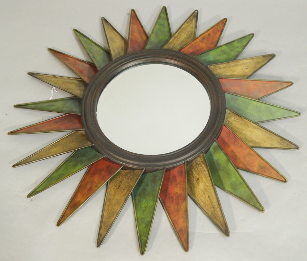 Appraisal: A modern vintage style metal sunburst wall mirror cm wide