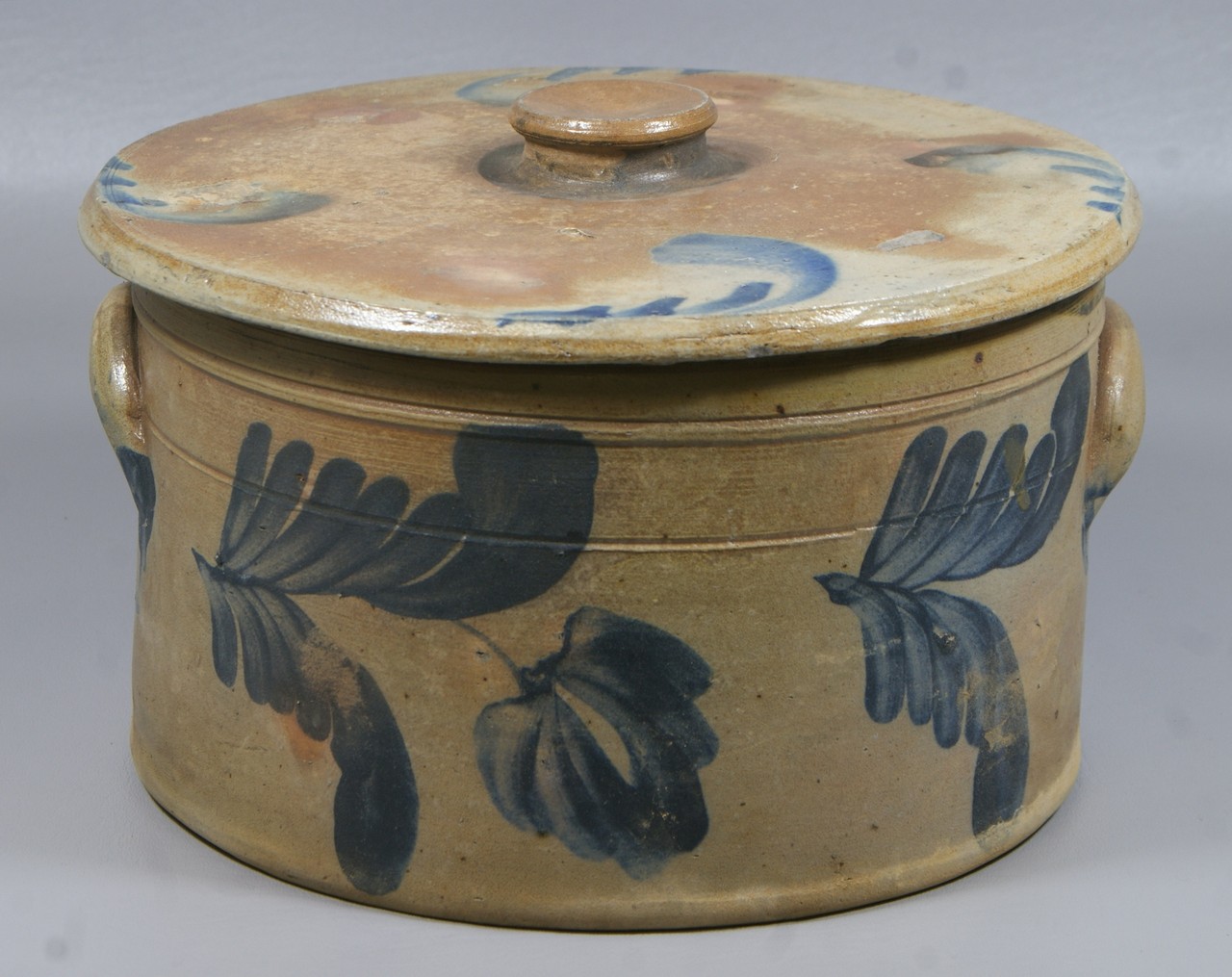 Appraisal: Blue decorated stoneware butter tub with lid extensive blue tulip