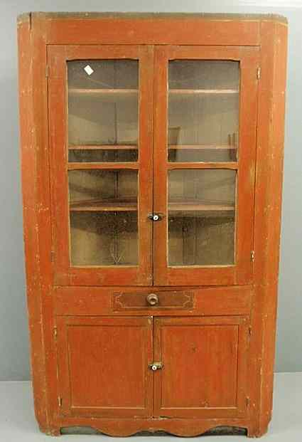 Appraisal: Ohio one-piece paint decorated corner cupboard early th c with