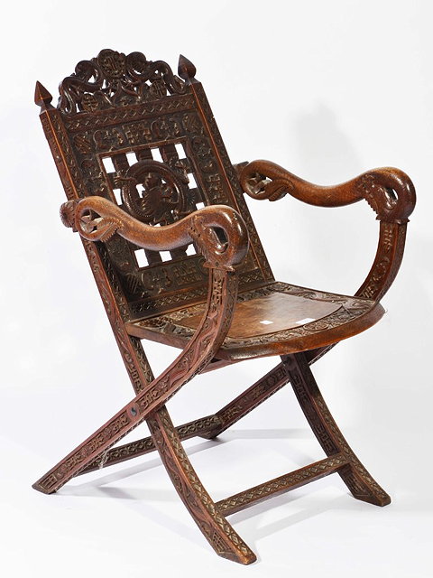 Appraisal: A CHINESE CARVED FOLDING CHAIR the back with central dragon